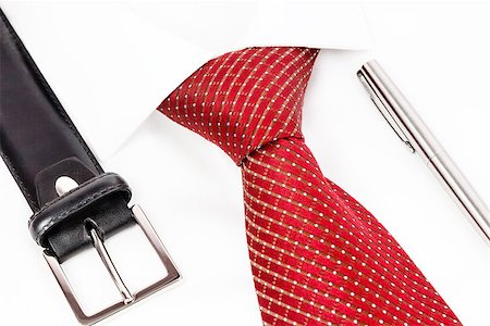 red tie knotted double Windsor, leather belt and silver pen Photographie de stock - Aubaine LD & Abonnement, Code: 400-08501980