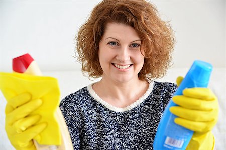 happy woman in rubber gloves with a cleaning agents Stock Photo - Budget Royalty-Free & Subscription, Code: 400-08502491