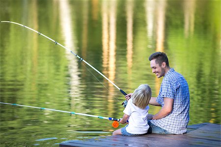 father and son fishing dock lake - Dad and son fishing outdoors Stock Photo - Budget Royalty-Free & Subscription, Code: 400-08502964