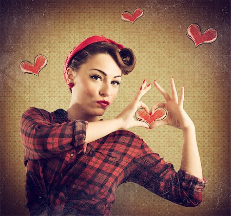 simsearch:400-04834980,k - Girl makes a heart with her hands Stock Photo - Budget Royalty-Free & Subscription, Code: 400-08503208