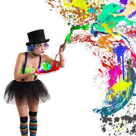 simsearch:400-08705605,k - Painter clown paints with brush and palette Stock Photo - Budget Royalty-Free & Subscription, Code: 400-08503322