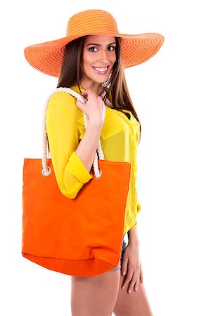 simsearch:400-07986693,k - young woman wearing yellow shirt and orange hat on white background Stock Photo - Budget Royalty-Free & Subscription, Code: 400-08503638