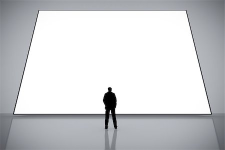 A man in front of a big white empty screen Stock Photo - Budget Royalty-Free & Subscription, Code: 400-08503695