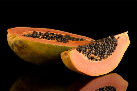 Fresh and tasty papaya on black background. Stock Photo - Budget Royalty-Free & Subscription, Code: 400-08528561
