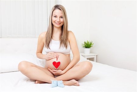 simsearch:400-08529613,k - Young pregnant woman relaxing on the bed Stock Photo - Budget Royalty-Free & Subscription, Code: 400-08528635