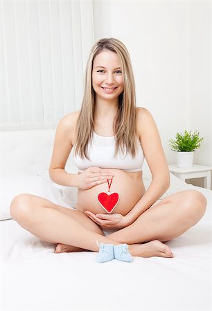 simsearch:400-08529613,k - Young pregnant woman relaxing on the bed Stock Photo - Budget Royalty-Free & Subscription, Code: 400-08528636