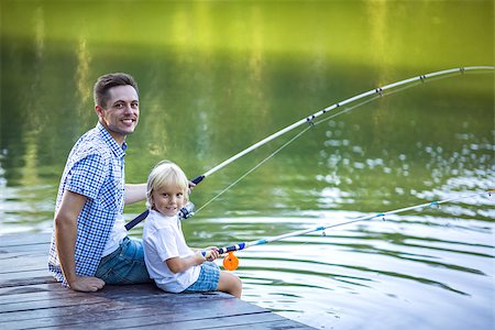 father and son fishing dock lake - Dad and son fishing outdoors Stock Photo - Budget Royalty-Free & Subscription, Code: 400-08529492