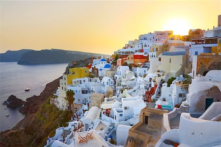 simsearch:400-04468669,k - World famous traditional whitewashed chuches and houses of Oia village on Santorini island, Greece. Sunset. Stock Photo - Budget Royalty-Free & Subscription, Code: 400-08529591