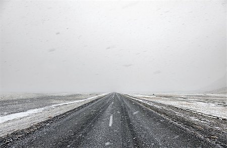 snow road horizon - Snow falling on a country road in iceland in the winter Stock Photo - Budget Royalty-Free & Subscription, Code: 400-08530359