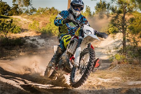 Enduro bike rider on action. Turn on sand terrain. Stockbilder - Microstock & Abonnement, Bildnummer: 400-08531390