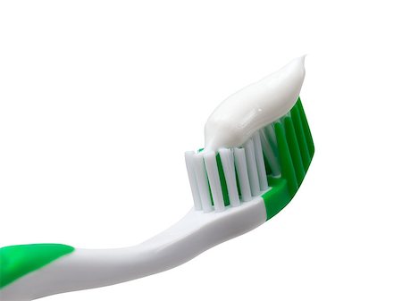simsearch:400-06327889,k - Green toothbrush with toothpaste. Isolated on white background. Photographie de stock - Aubaine LD & Abonnement, Code: 400-08532384