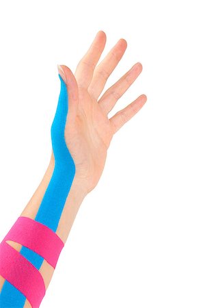 simsearch:400-08318516,k - Kinesio tape on female hand isolated on white background. Chronic pain, alternative medicine. Rehabilitation and physiotherapy. Stockbilder - Microstock & Abonnement, Bildnummer: 400-08532668