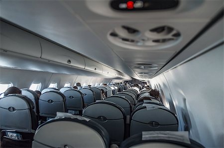 passenger inside airplane - Interior airplane with passengers. Aircraft cabin after take off Stock Photo - Budget Royalty-Free & Subscription, Code: 400-08533868