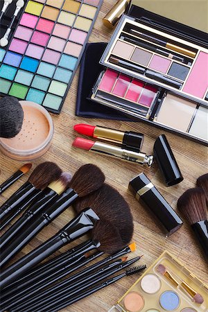 Set of  brushes, lipsticks, maskara, eye shadows and  powder, top view Stock Photo - Budget Royalty-Free & Subscription, Code: 400-08554142