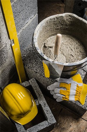 simsearch:400-08553696,k - Tools for bricklayer bucket with a solution and a trowel, close-up Fotografie stock - Microstock e Abbonamento, Codice: 400-08555823