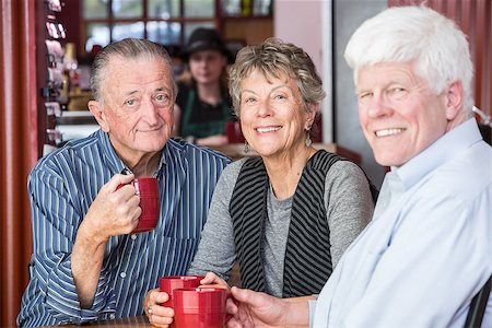 Group of three mature friends in a coffee house Stock Photo - Budget Royalty-Free & Subscription, Code: 400-08555834