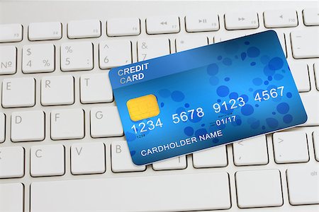 simsearch:400-04382597,k - blue  plastic debit card  on modern keyboard - internet shopping concept Stock Photo - Budget Royalty-Free & Subscription, Code: 400-08551474