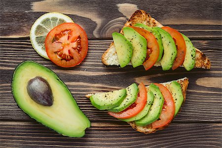 sandwich with avocado - Two toasts with fresh vegetables perfect for second breackfast. Natural background, shooting angle 90 degrees. Stock Photo - Budget Royalty-Free & Subscription, Code: 400-08551768