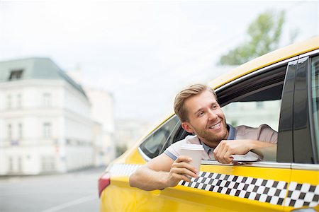 simsearch:400-05724756,k - Young man in yellow taxi Stock Photo - Budget Royalty-Free & Subscription, Code: 400-08552806