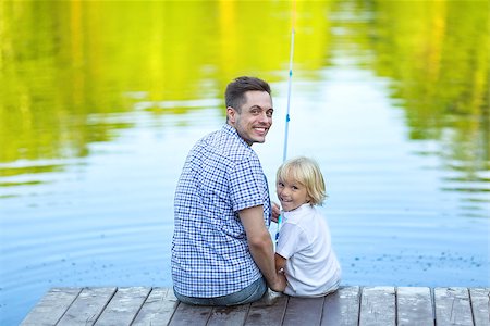father and son fishing dock lake - Family fishing on the pier Stock Photo - Budget Royalty-Free & Subscription, Code: 400-08552809