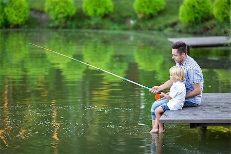 father and son fishing dock lake - Father and son fishing on the lake Stock Photo - Budget Royalty-Free & Subscription, Code: 400-08552810