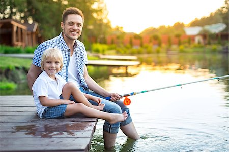 father and son fishing dock lake - Father and son fishing on the lake Stock Photo - Budget Royalty-Free & Subscription, Code: 400-08552828