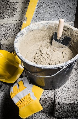 simsearch:400-08553696,k - Tools for bricklayer bucket with a solution and a trowel, close-up Fotografie stock - Microstock e Abbonamento, Codice: 400-08553038