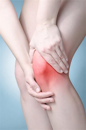 simsearch:400-08318516,k - A young woman massaging her painful knee Stockbilder - Microstock & Abonnement, Bildnummer: 400-08553091