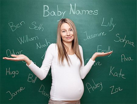 simsearch:400-04205919,k - Pregnant woman trying to choose a name for her baby Stock Photo - Budget Royalty-Free & Subscription, Code: 400-08553114