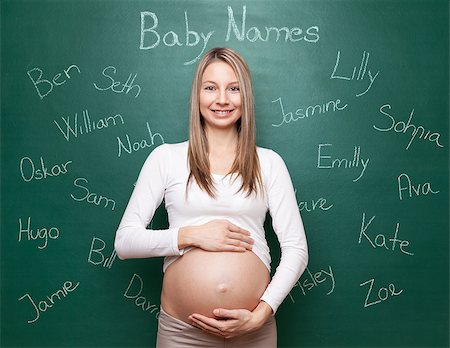 simsearch:400-04205919,k - Pregnant woman trying to choose a name for her baby Stock Photo - Budget Royalty-Free & Subscription, Code: 400-08553115