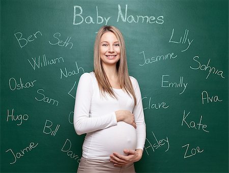 simsearch:400-04205919,k - Pregnant woman trying to choose a name for her baby Stock Photo - Budget Royalty-Free & Subscription, Code: 400-08553113