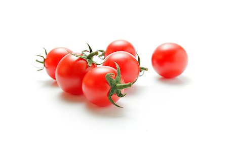 Fresh ripe cherry tomatoes closeup isolated on white background. Stock Photo - Budget Royalty-Free & Subscription, Code: 400-08553369