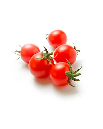 Fresh ripe cherry tomatoes scattered isolated on a white background Stock Photo - Budget Royalty-Free & Subscription, Code: 400-08553370