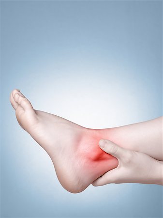 simsearch:400-08318516,k - A young woman massaging her painful ankle Stockbilder - Microstock & Abonnement, Bildnummer: 400-08553689