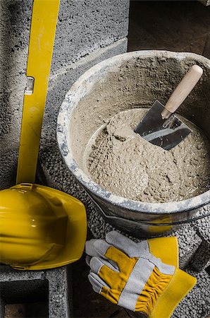 simsearch:400-08553696,k - Tools for bricklayer bucket with a solution and a trowel, close-up Fotografie stock - Microstock e Abbonamento, Codice: 400-08553727
