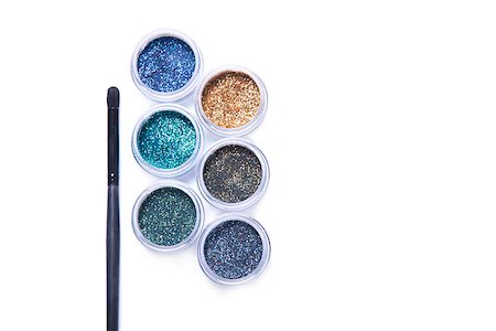 Makeup brush and colorful glitters in transparent jars, top view isolated on white background Stock Photo - Budget Royalty-Free & Subscription, Code: 400-08553897