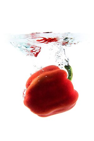 raulmellado (artist) - red pepper on white background falling and splashing water, giving a unique feeling of freshness and vitality Foto de stock - Royalty-Free Super Valor e Assinatura, Número: 400-08574034