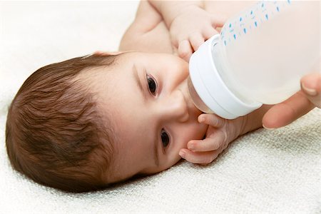 simsearch:400-05258814,k - Cute newborn baby eating from the plastic bottle Stock Photo - Budget Royalty-Free & Subscription, Code: 400-08574302