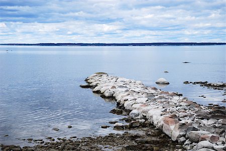 An old stone pier by the coast in a calm bay at the swedish island Oland Foto de stock - Super Valor sin royalties y Suscripción, Código: 400-08574859