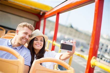 Young couple in a tourist bus makes selfie Stock Photo - Budget Royalty-Free & Subscription, Code: 400-08572937