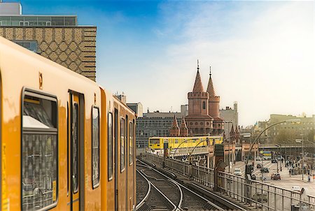 sunset subway train - Panoramic view of Berliner U-Bahn trains with Oberbaumbridge in the background in golden evening light at sunset, Berlin Friedrichshain-Kreuzberg, Germany Stock Photo - Budget Royalty-Free & Subscription, Code: 400-08572931