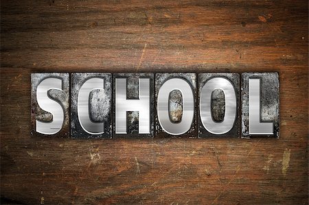 The word "School" written in vintage metal letterpress type on an aged wooden background. Stock Photo - Budget Royalty-Free & Subscription, Code: 400-08573100