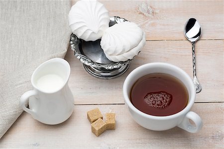simsearch:659-03533716,k - Set of cup black tea and dessert on bright wooden table Stock Photo - Budget Royalty-Free & Subscription, Code: 400-08573228