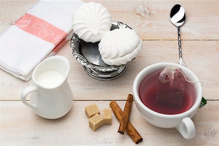 simsearch:659-03533716,k - Set of cup red tea and dessert on bright wooden table Stock Photo - Budget Royalty-Free & Subscription, Code: 400-08573230