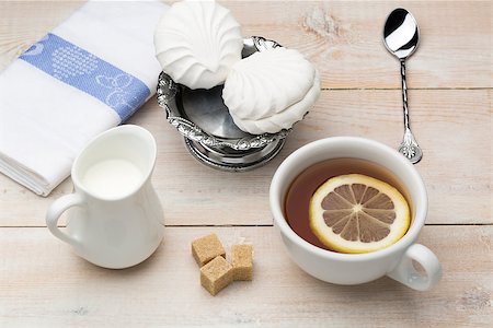 simsearch:659-03533716,k - Set of white cup of black tea with slice lemon and sweet dessert Stock Photo - Budget Royalty-Free & Subscription, Code: 400-08573231