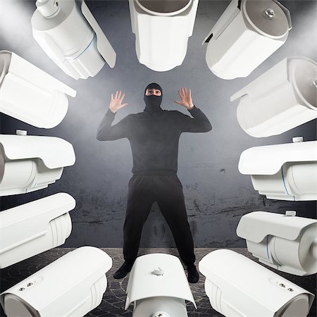 simsearch:400-05729571,k - Surveillance cameras pointed at a frightened thief Stock Photo - Budget Royalty-Free & Subscription, Code: 400-08615005