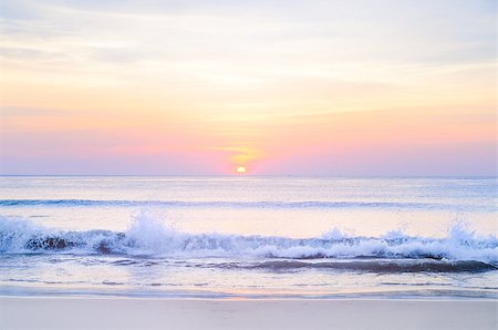 sunrise at sea on beach Stock Photo - Budget Royalty-Free & Subscription, Code: 400-08615041