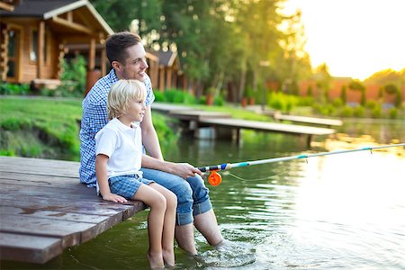 father and son fishing dock lake - Dad and son fishing outdoors Stock Photo - Budget Royalty-Free & Subscription, Code: 400-08616080