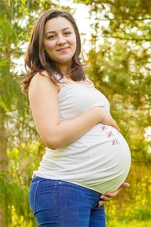 portrait of pregnant young woman outdoors in warm summer day Foto de stock - Super Valor sin royalties y Suscripción, Código: 400-08616779