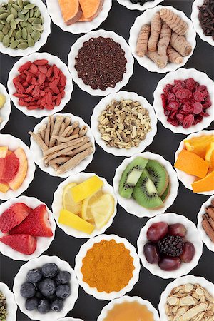 simsearch:400-08618279,k - Super food and medicinal herb selection for cold and flu remedy including foods high in antioxidants and vitamin c over grey background. Photographie de stock - Aubaine LD & Abonnement, Code: 400-08618279